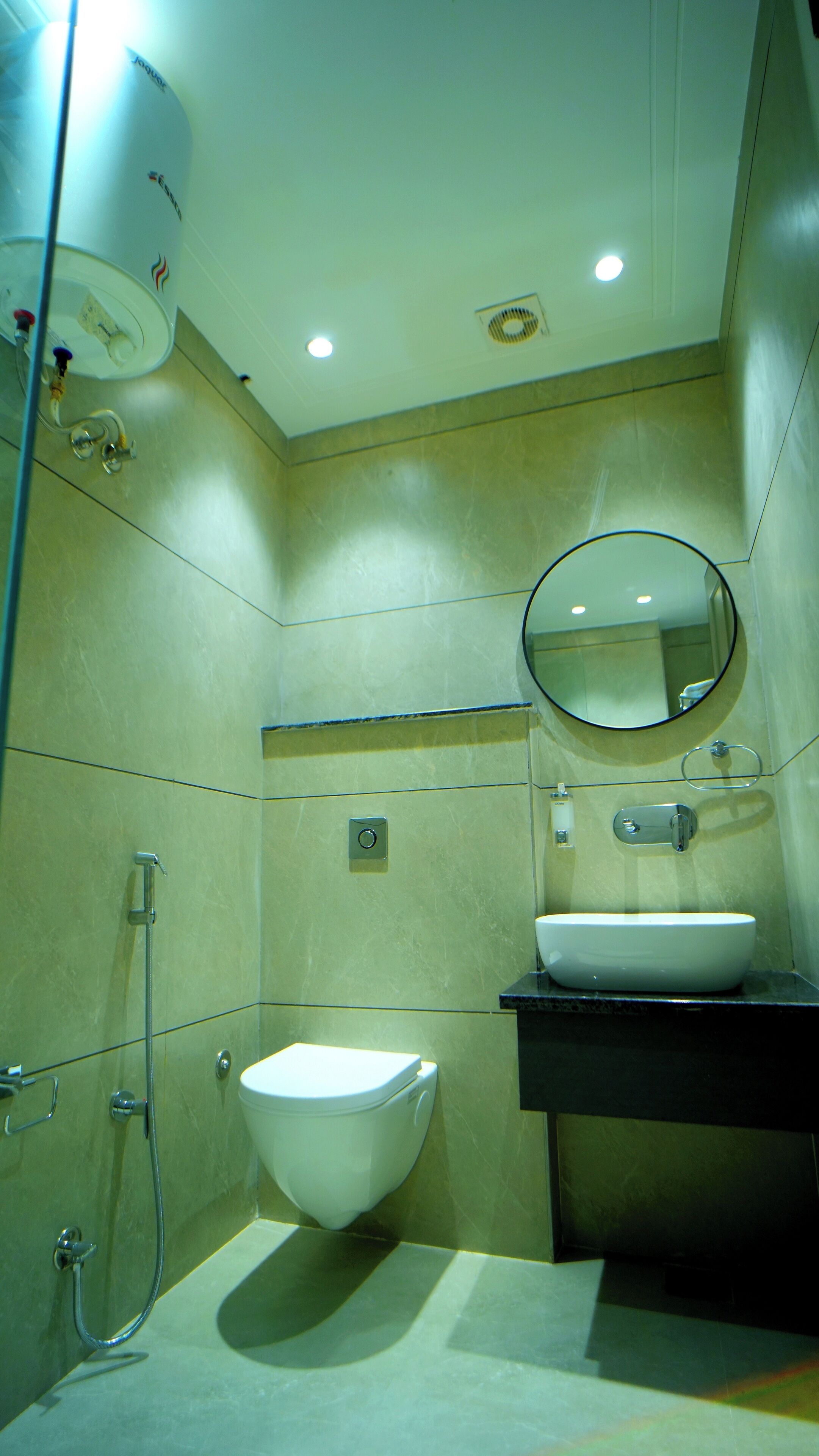 A modern bathroom with a toilet, sink, and shower.