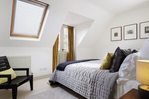 1 bedroom, desk, iron/ironing board, travel crib