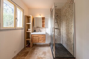 Shower, hair dryer, towels, toilet paper
