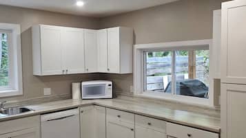 Fridge, microwave, stovetop, cookware/dishes/utensils