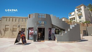 A building with a unique architectural design, featuring a gym and spa, and a salon.