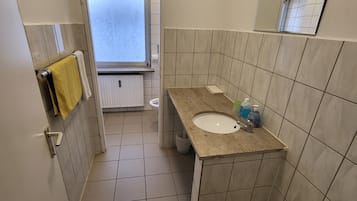 Basic Double Room | Bathroom | Shower, towels, toilet paper