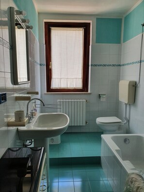 Hair dryer, bidet, towels, soap