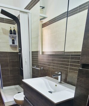 Shower, eco-friendly toiletries, hair dryer, bidet