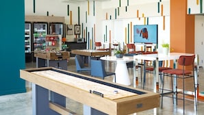 A modern indoor space with a pool table, seating area, and a bar. - Quiet City Getaway, Near Regions Field and Food (Birmingham)