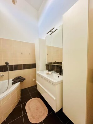 Shower, eco-friendly toiletries, hair dryer, towels