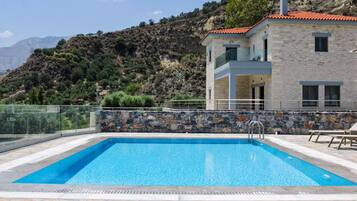 Seasonal outdoor pool, pool umbrellas