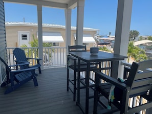 Outdoor dining - St James City brand new 3-bedroom home with WiFi, AC and boat lift (Saint James City)