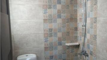 Shower, towels, soap, toilet paper