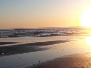 On the beach, sun loungers, beach towels