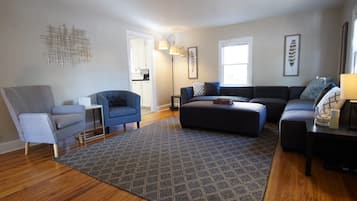 House, Multiple Beds, Patio, Garden View (915 23rd St - Group) | Living area | 50-inch flat-screen TV with digital channels