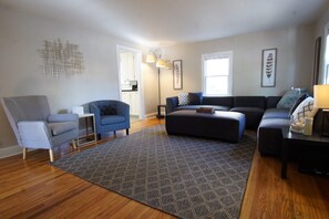 House, Multiple Beds, Patio, Garden View (915 23rd St - Group) | Living area | 50-inch flat-screen TV with digital channels