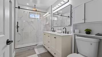 Shower, hair dryer, towels, soap