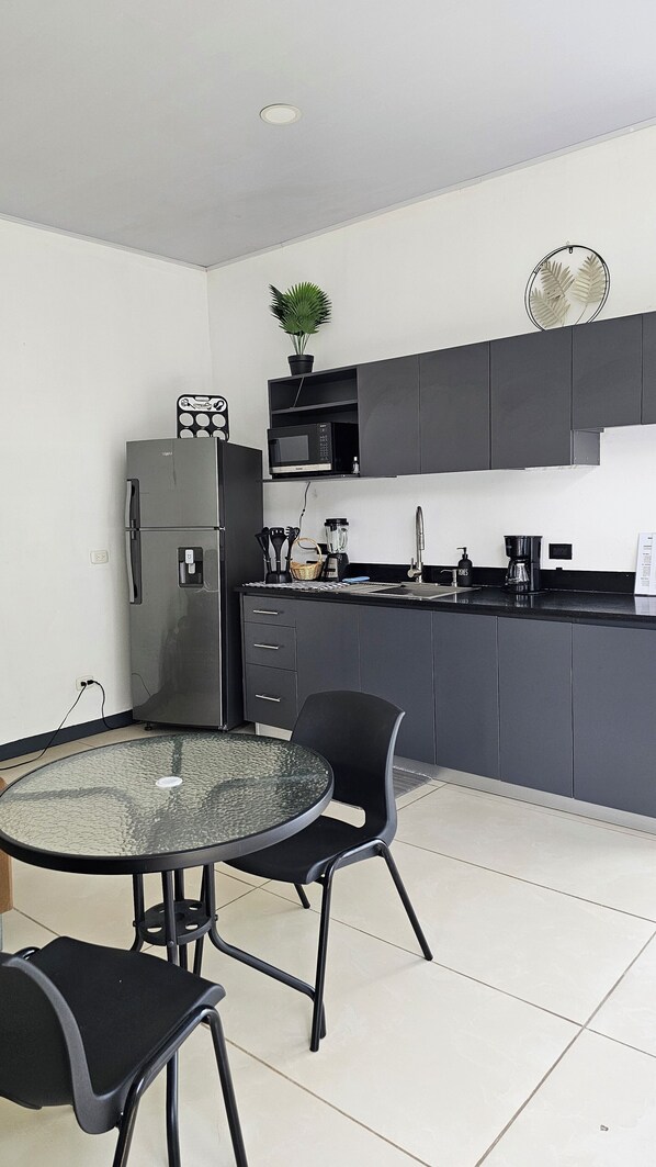 Fridge, microwave, stovetop, coffee/tea maker