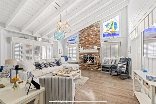 Smart TV, fireplace, table football, books