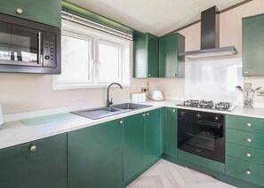 Fridge, oven, stovetop, toaster - 2 bedroom accommodation in Caersws (Caersws)
