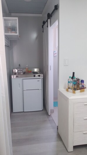 Fridge, stovetop, electric kettle, cookware/dishes/utensils