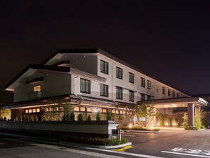 A modern hotel with a flat roof, multiple windows, and a well-lit entrance area. - Grandvrio Hotel Tamba Sasayama (Sasayama)