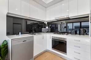 Fridge, microwave, oven, stovetop - Comfortable 2BR Retreat with Balcony & Parking (St Kilda)