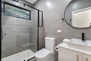 Shower, hair dryer, towels, shampoo