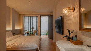A hotel room with two beds, a large window with blinds, a flat-screen TV, a bathroom with a large mirror, and a tiled floor. - Cloud 9 Hotel (Luoyang)