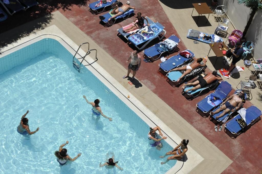 Seasonal outdoor pool, open 9:00 AM to 7:00 PM, pool umbrellas