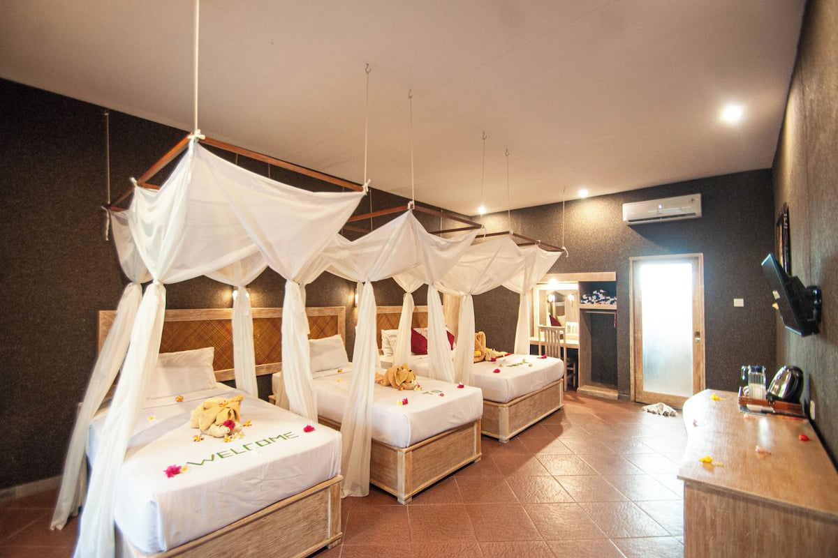 Deluxe Room, Multiple Beds, Balcony, Garden View | Free WiFi