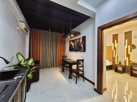 Deluxe Studio, City View | In-room safe, desk, laptop workspace, blackout drapes