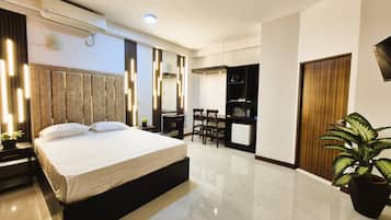 Comfort Studio, City View | 3 bedrooms, in-room safe, desk, laptop workspace