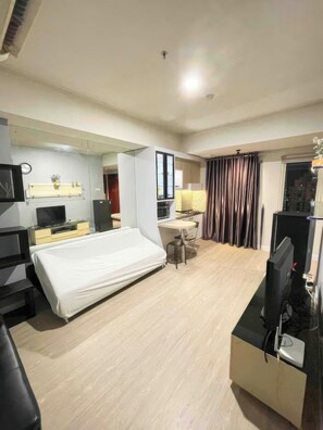 Superior Apartment, 2 Bedrooms, Balcony, City View | Living area | 35-inch TV with cable channels