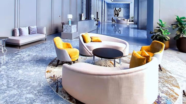 A spacious lobby with a modern design, featuring a reception desk, seating areas, and a large open space with a view of the reception area. - Premium Luxury Menara Jakarta Residence (Jakarta)