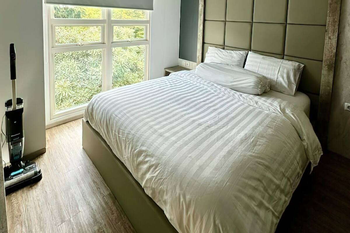 Deluxe Apartment, 2 Bedrooms, Balcony, City View | 1 bedroom, minibar, blackout drapes, soundproofing