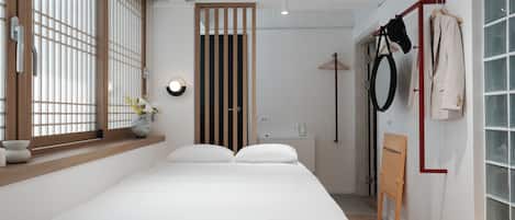 Premium bedding, pillow-top beds, laptop workspace, free WiFi
