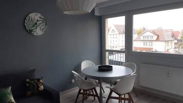 Classic Apartment, City View | Living area | TV