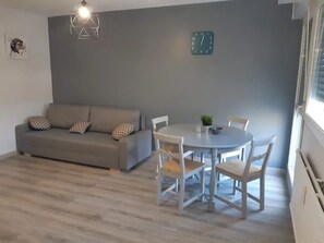 Standard Apartment, City View | Living area | TV - La Maison De Céline (Arry)