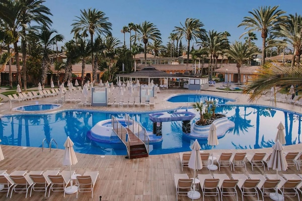 Outdoor pool, open 11:00 AM to 6:00 PM, pool umbrellas, sun loungers