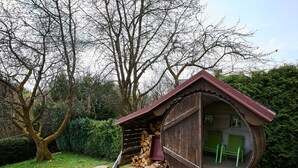 A rustic wooden structure with a sloped roof, a door, and a small window. - Beautiful private villa with WIFI, private pool, TV, terrace, pets allowed and panoramic view (Semily)