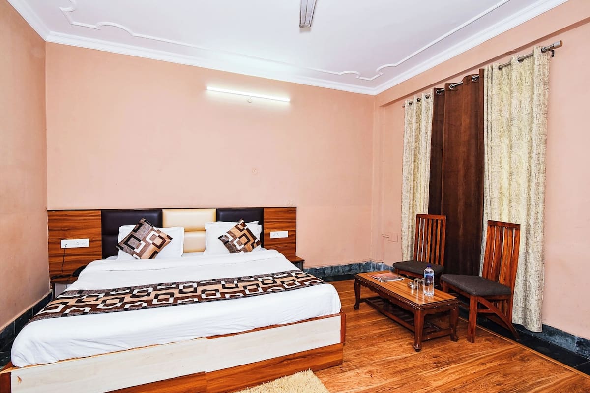 Desk, laptop workspace, bed sheets