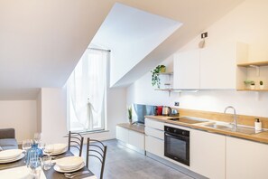 Deluxe Apartment, Balcony, City View | Living area | 101-cm LED TV with digital channels