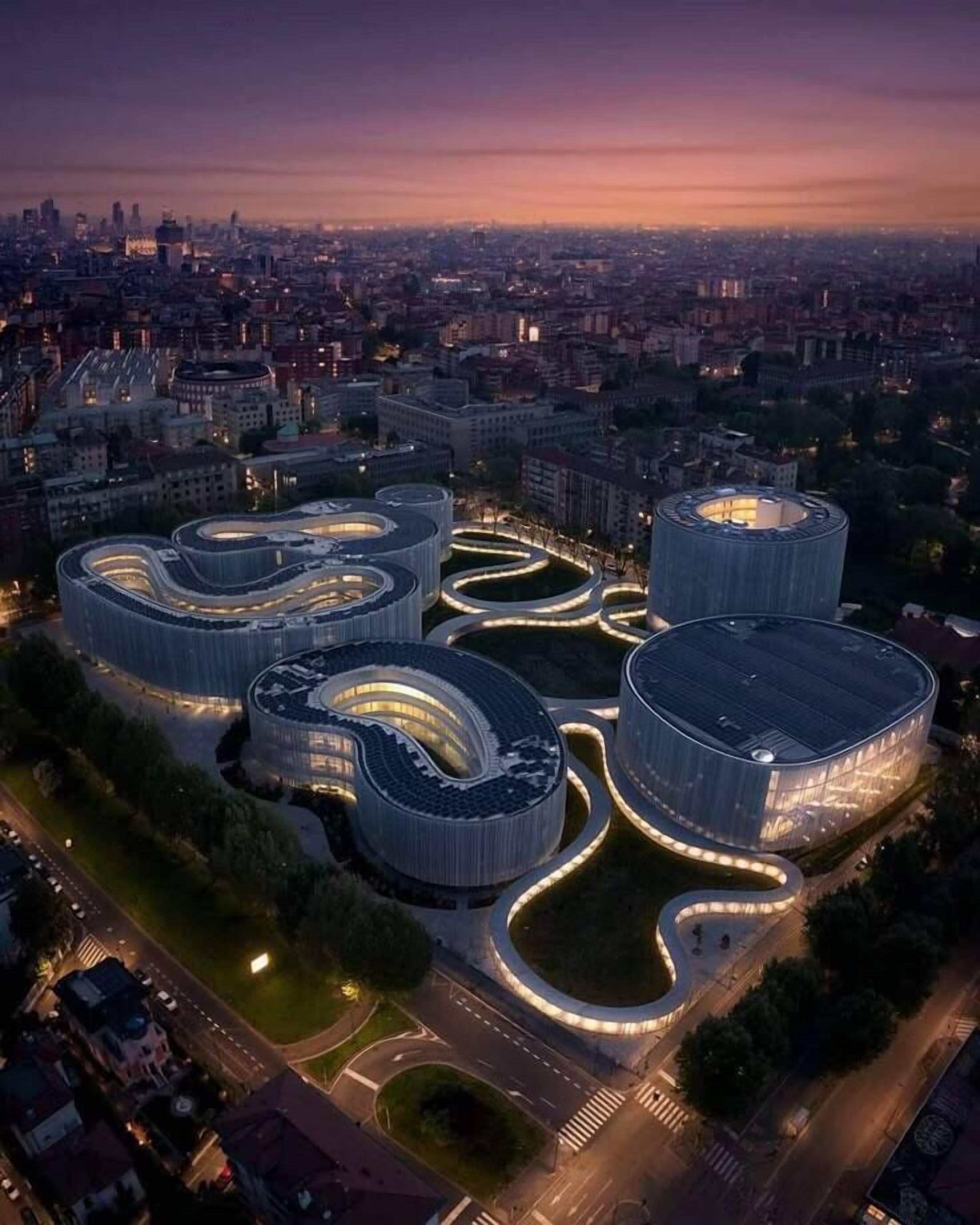 A modern architectural complex with interconnected circular buildings and a central open space.