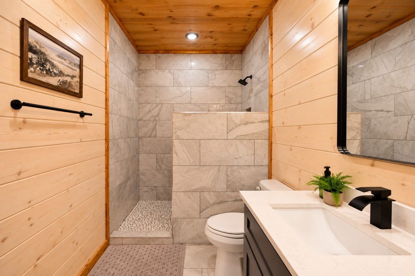 A bathroom with a shower, toilet, and sink, featuring wooden walls and a marble floor.