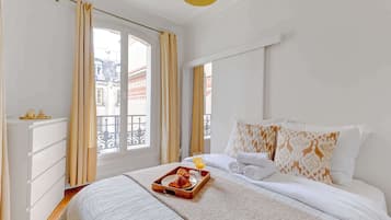 1 bedroom, desk, iron/ironing board, travel crib