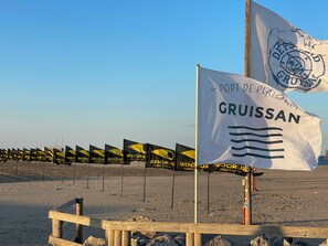 On the beach, sun-loungers