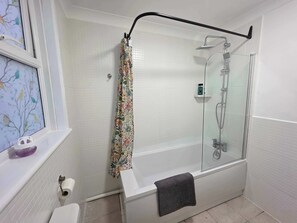 Shower, hair dryer, towels, shampoo