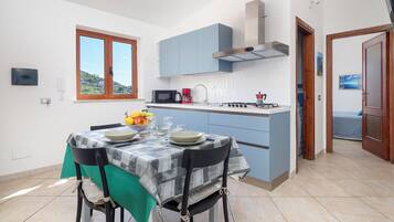 Panoramic Apartment, Sea View | Private kitchen | Coffee/tea maker, electric kettle