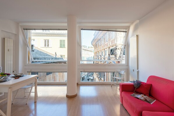 Standard Apartment, 1 Bedroom (Genova House Historic Center) | Living area | 21-inch flat-screen TV with cable channels