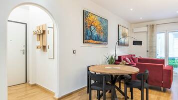 Classic Apartment, Balcony | Living area | 56-inch Smart TV with digital channels, Netflix, books