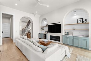 Smart TV, fireplace, books, offices