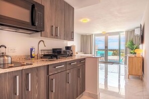 Fridge, microwave, stovetop, coffee/tea maker