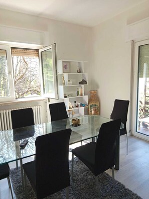 Enjoy meals in this dining area with a glass-top table and comfortable seating for four.